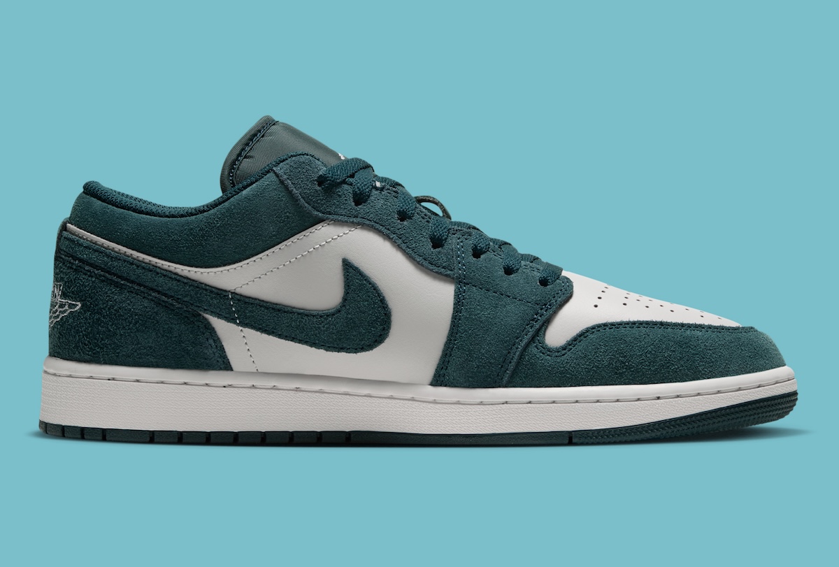 Air Jordan 1 Low Midnight Spruce detail shot showing Swoosh and suede texture