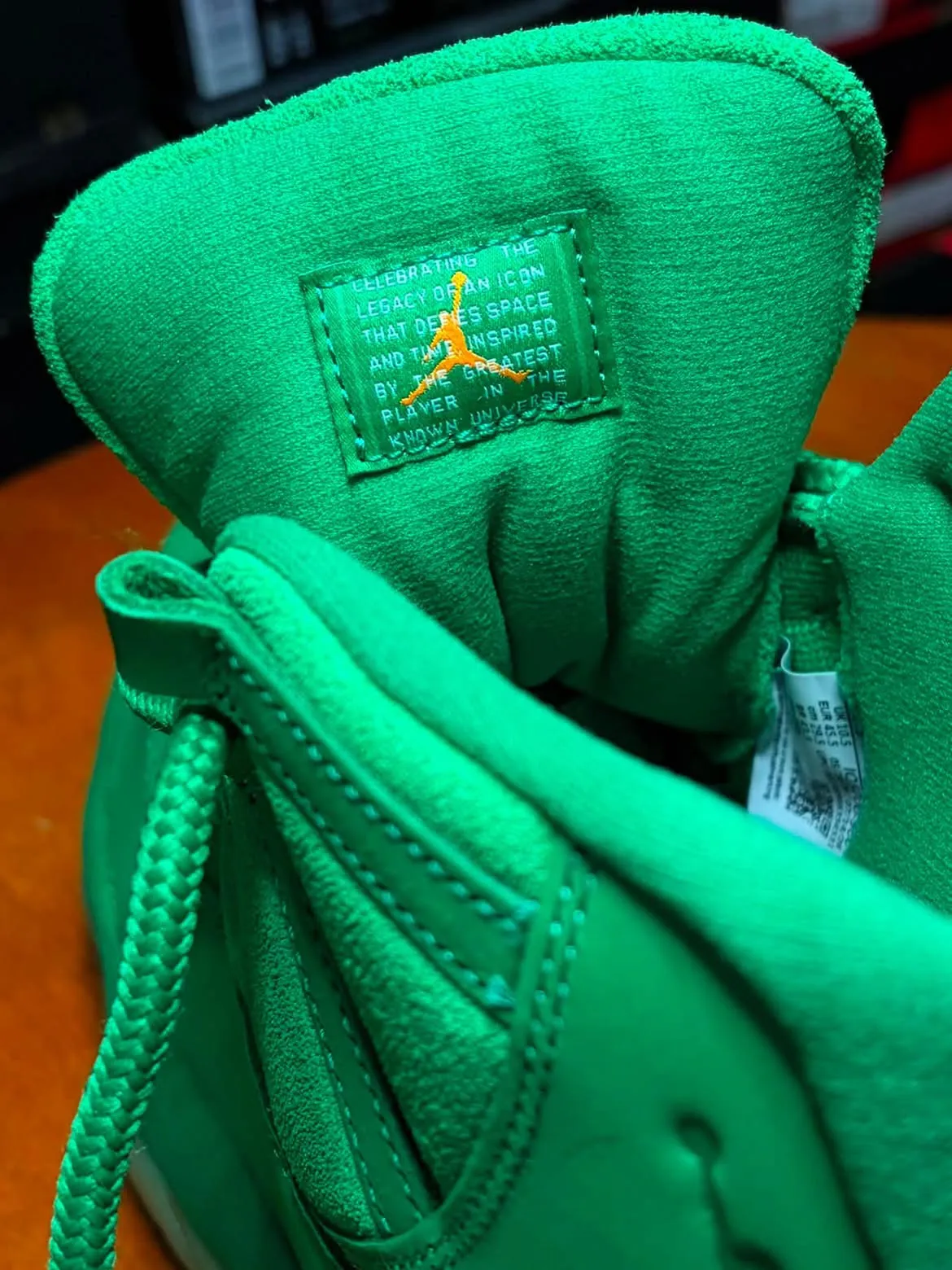 Air Jordan 11 Green Screen glow-in-the-dark outsole with orange pods