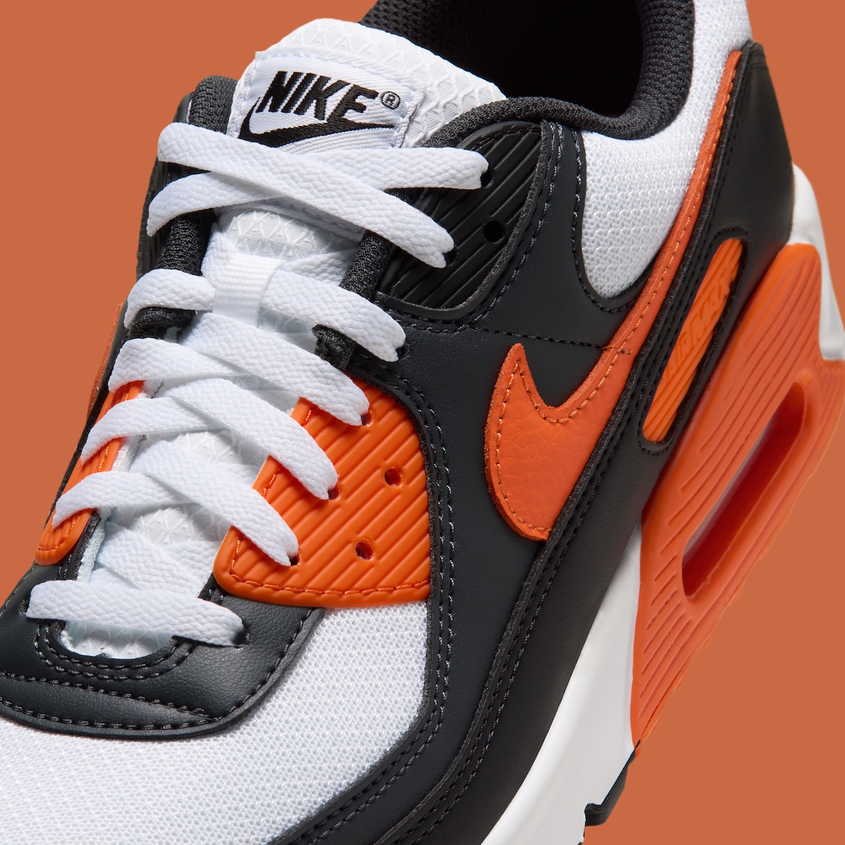 Nike Air Max 90 Halloween 2026 close up of safety orange swoosh and eyelets