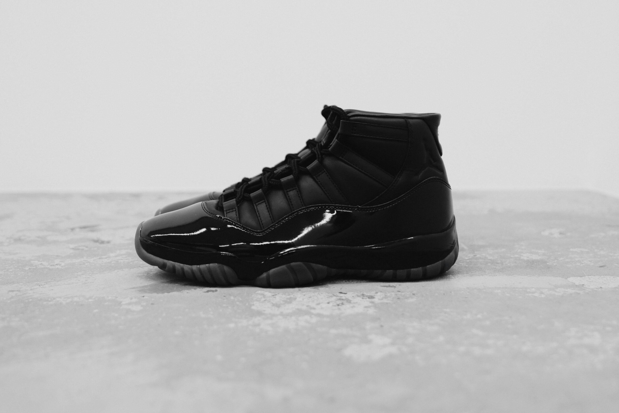 CDG Homme Plus x Air Jordan 11 campaign image showing the collaborative sneaker