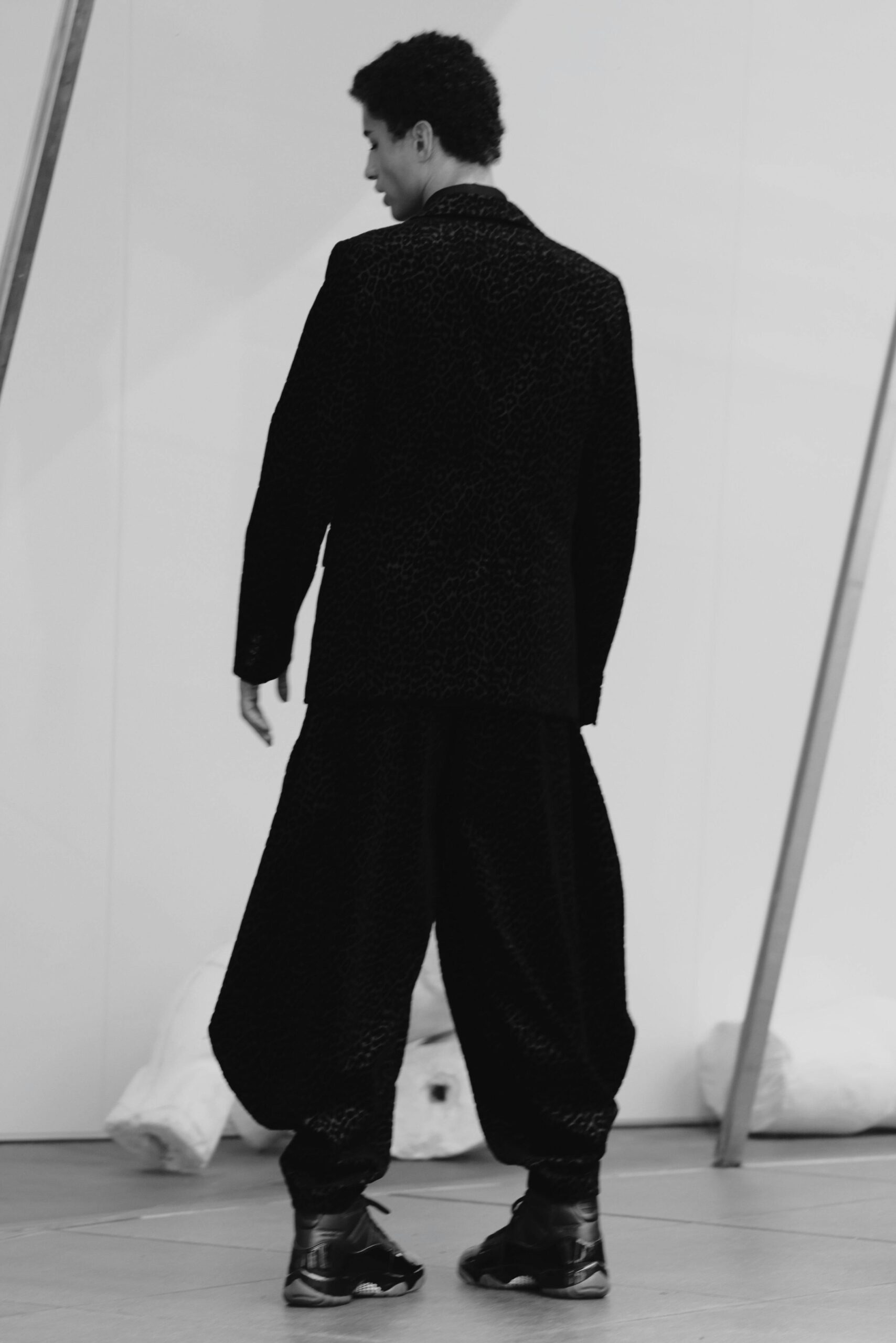 CDG Homme Plus x Air Jordan 11 black colorway with embossed branding
