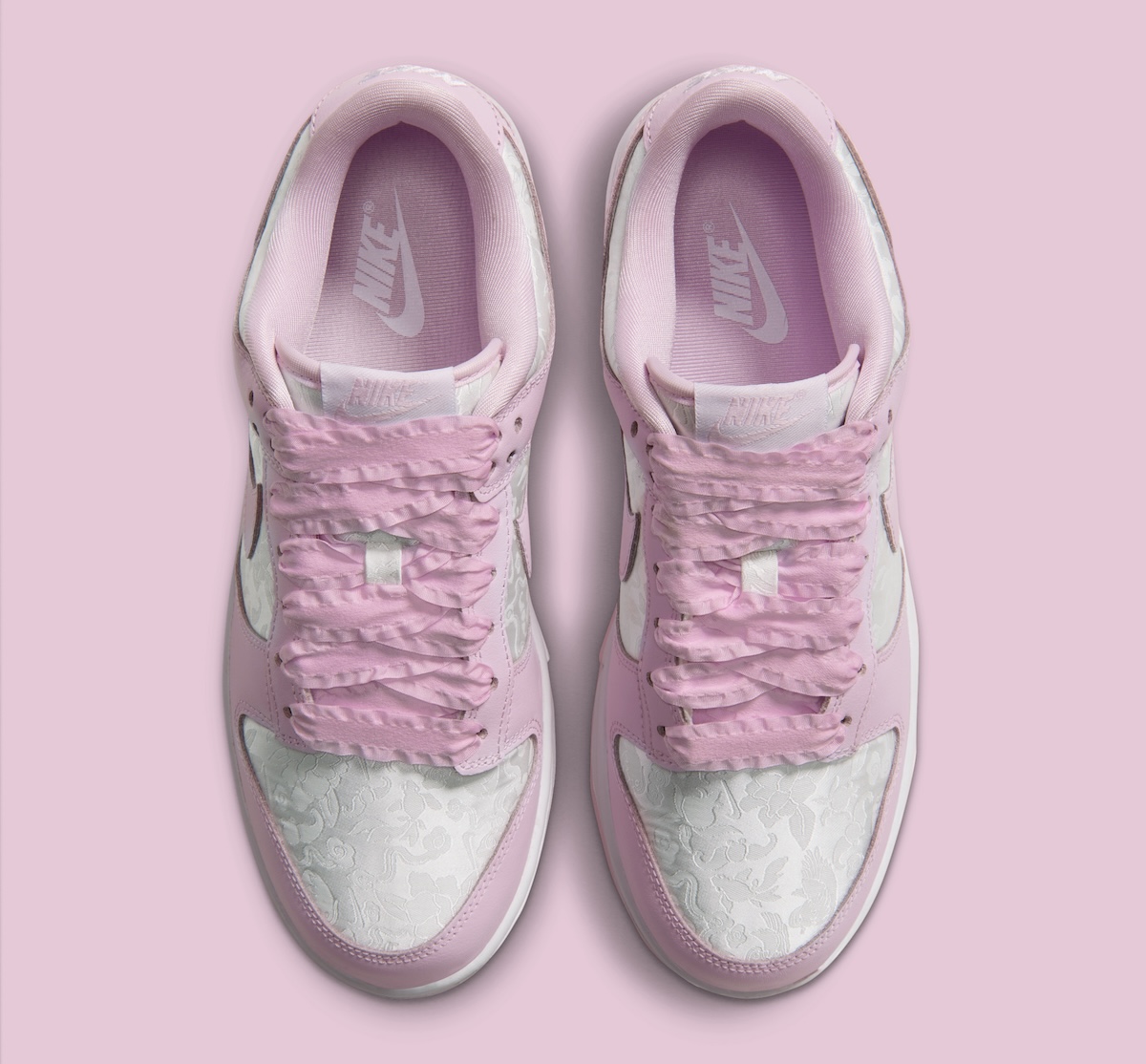 Nike Dunk Low Pink Foam close-up of jacquard floral weave and pink Swoosh
