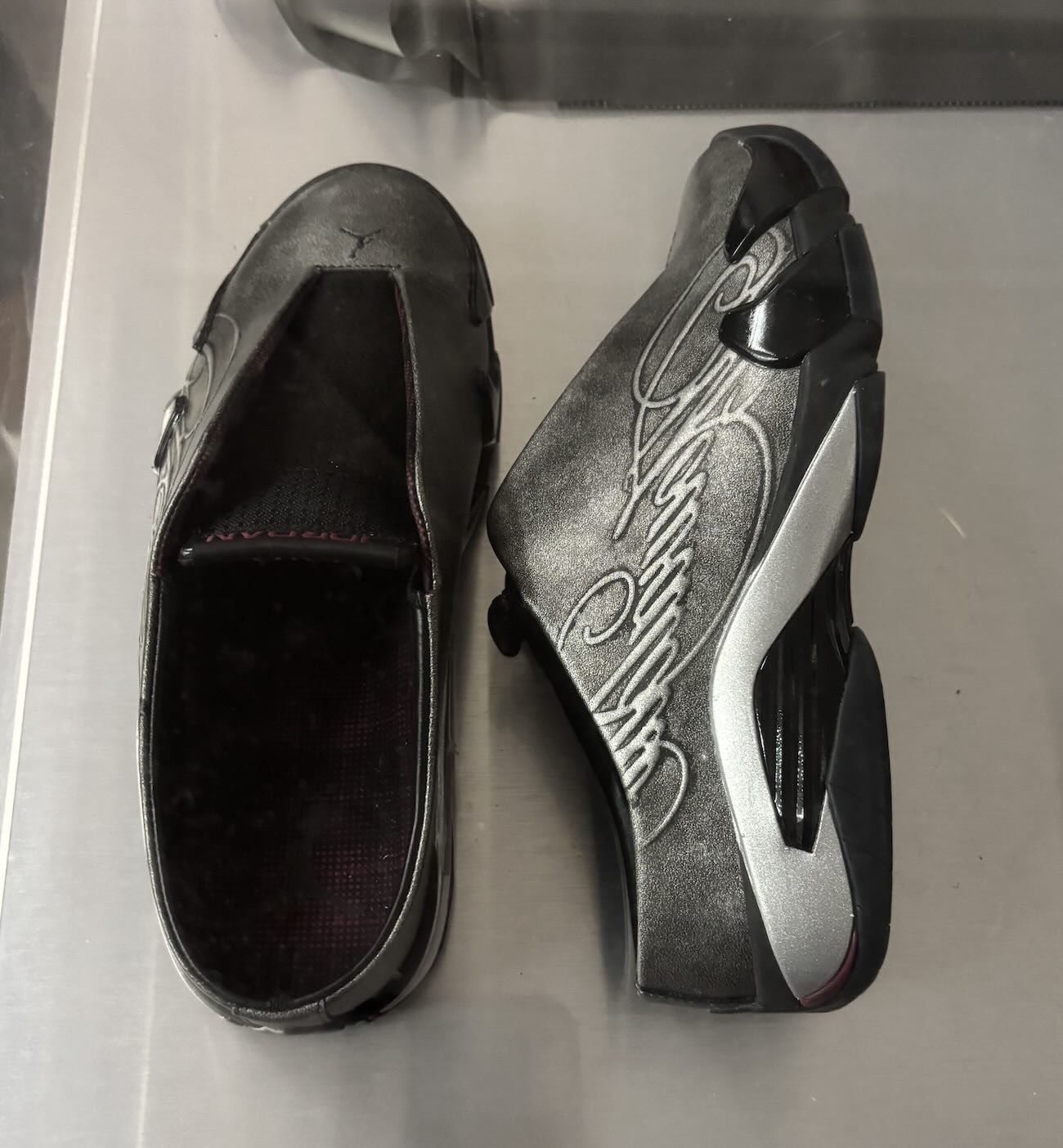 Mowalola Air Jordan 14 side profile showing tartan etching