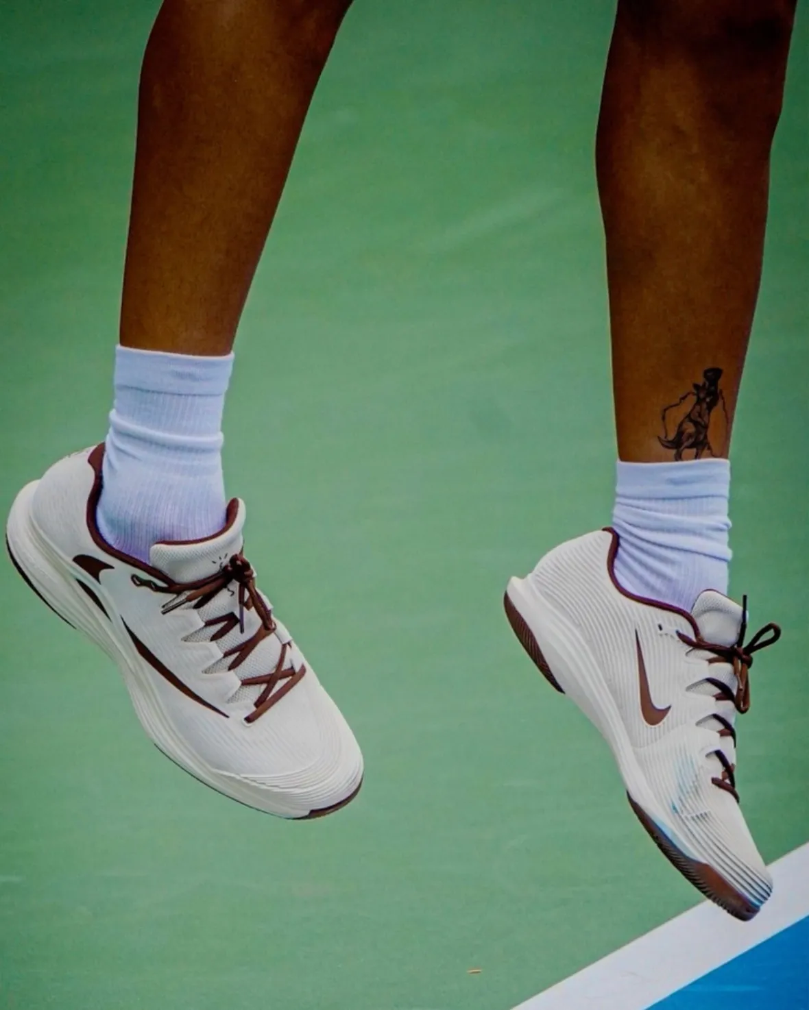 Travis Scott x Nike Zoom Vapor 12 HC Cactus Court detail showing reverse Swoosh and color blocking