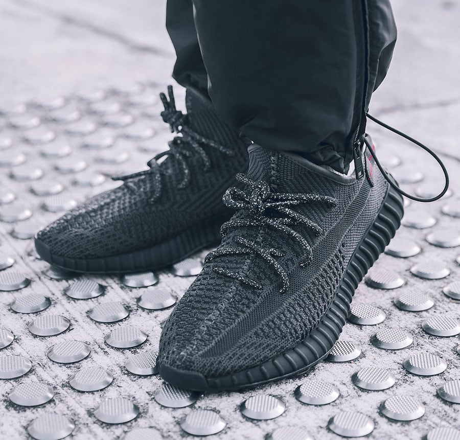 Yeezy Boost 350 V2 Black on feet side profile