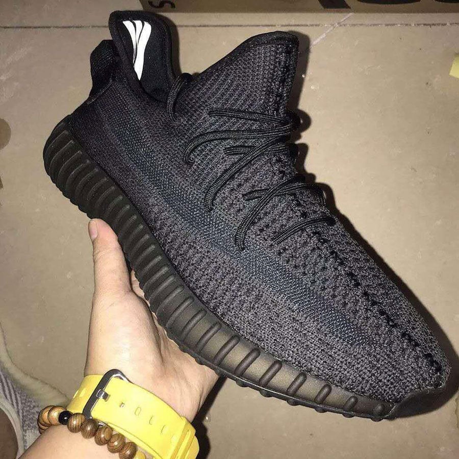 Yeezy Boost 350 V2 Black held in hand