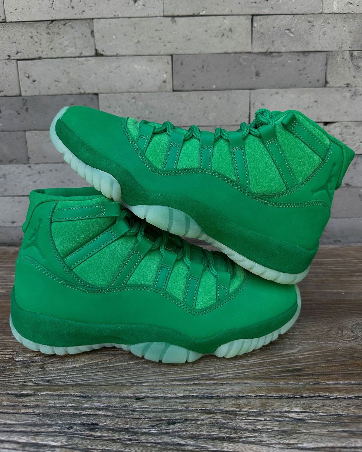 Air Jordan 11 Green Screen pair shot showing tonal green suede and nubuck materials