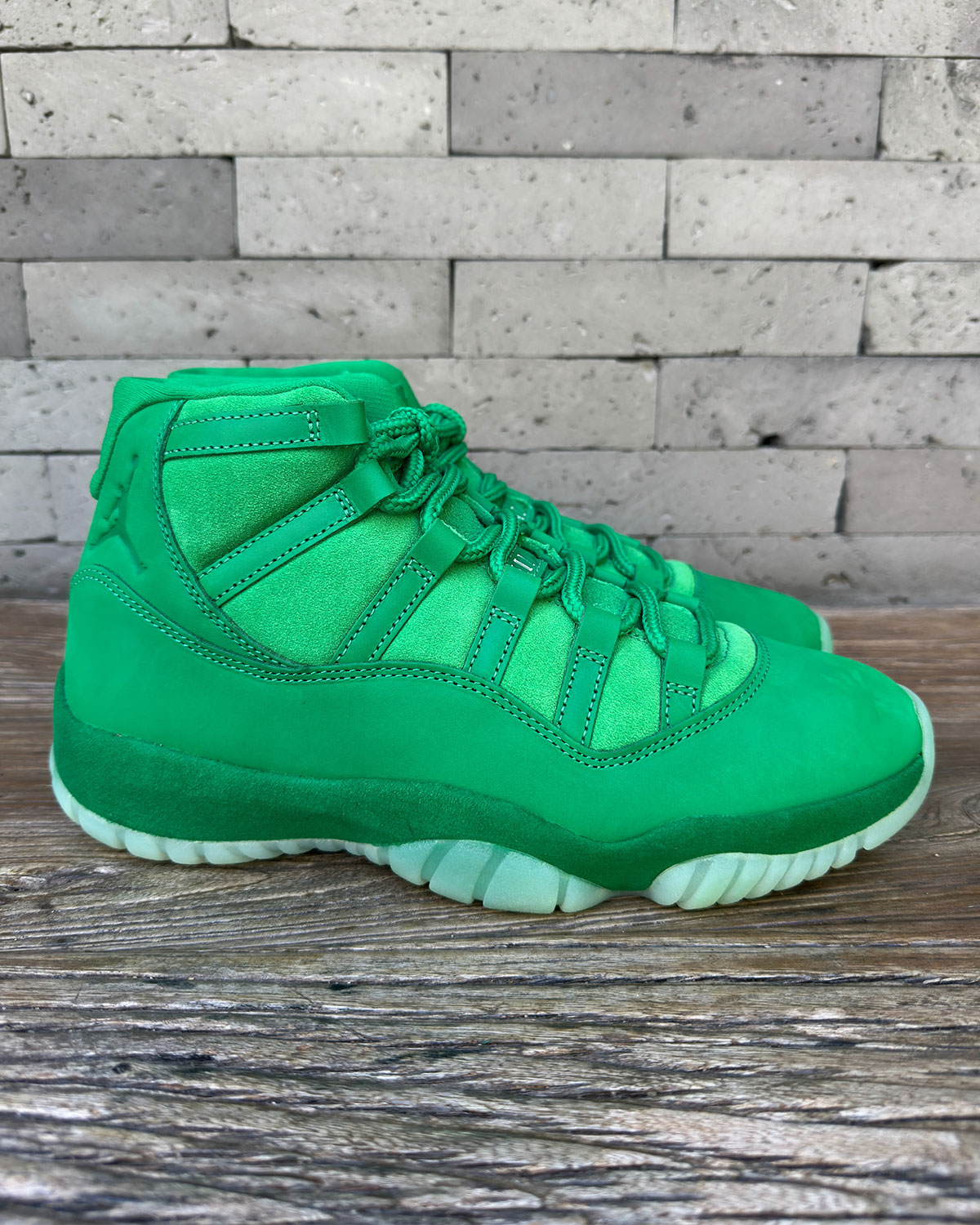 Air Jordan 11 Green Screen side profile showing glow-in-the-dark translucent outsole with orange pods